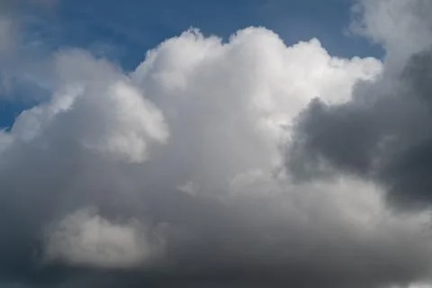 Wide cinematic cloudscape with layered tones, gradient from bright top to s.. Stockfoto's