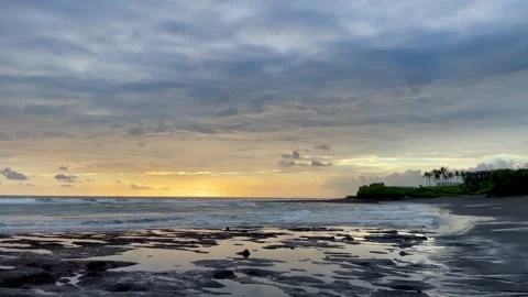 Wide Cinematic Sunset Beach with Tidal Pools and Rocky Shore in Bali Stock Footage 337270128