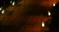 Wide city street at night with cars passing, vibrant life big city, time-lapse HD Footage