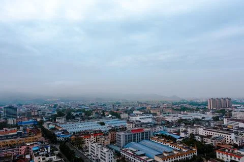 Wide city view under cloudy sky Stock Photos