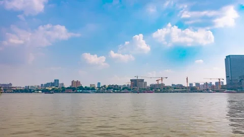Wide Cityscape View of Riverfront Construction and Modern Urban Skyline Video stock 342278482