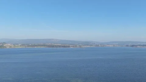 A wide, clear view over the calm blue waters of a coastal bay in O Grove, Spain Stock Footage 346674869