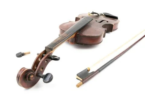 Wide closeup studio shot of old, broken, dust covered violin isolated on white Stock Photos