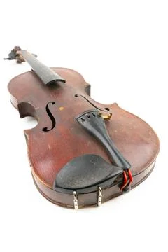 Wide closeup studio shot of old, broken, dust covered violin isolated on white Stock Photos