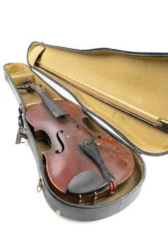 Wide closeup vertical studio shot of old, broken, dust covered violin with its Stock Photos