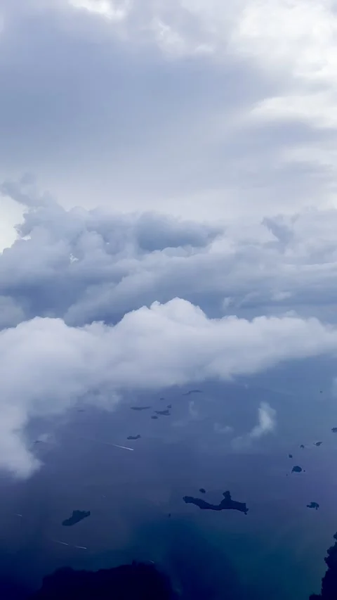 Wide cloudscape with rolling cumulus and clear horizon line from passenger Stock Footage 342330595