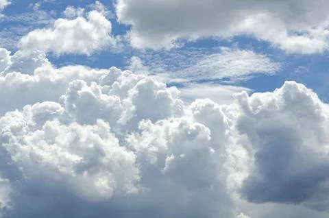 Wide cloudy sky with layered textures representing dreamy and uplifting nat.. Stock Photos