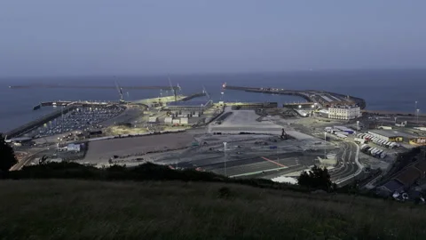 Wide coastal port infrastructure at dawn aerial Stock Footage 340264445