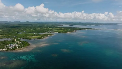 Wide coastal view with reefs and inland greenery. Siargao, Philippines. Stock Footage 337445201