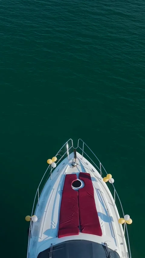 Wide composition combining luxury vessel, calm water, and scenic harbor elements Stock Footage 341769138