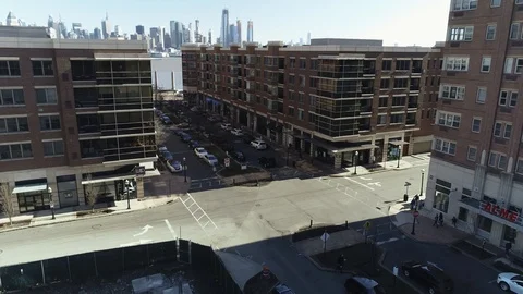 Wide crossing below riverfront apartments in West New York Vídeos de archivo 87966194