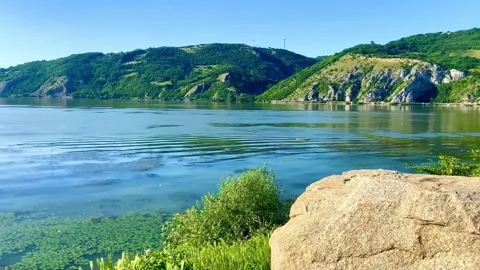Wide Danube. High cliffs above the water. A huge stone on the bank Stock Footage 249926688