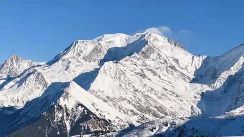Wide daytime view of the snow-covered Mont Blanc Massif in the French Alps, with Stock Footage 346721185