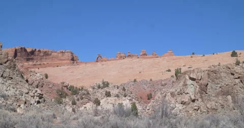 Wide of the Delicate Arch perched on top a mountainside in Arches National Park 스톡 동영상 303406536