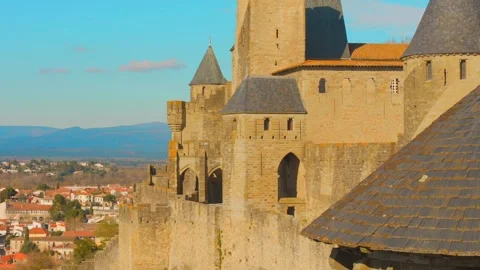 Wide descending view of Cité de Carcassonne and village below France Stock Footage 313345851
