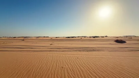 Wide desert landscape under blue clear sky and sun. View from fast moving car Stock Footage 340868875