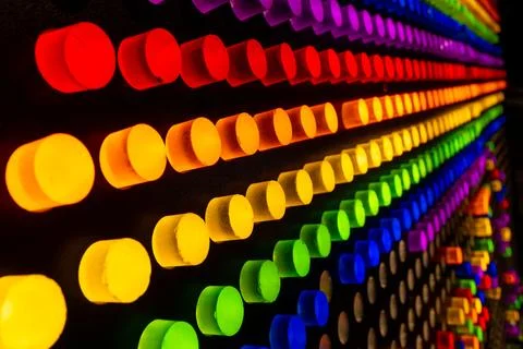 Wide Diagonal Rows of Glowing Rainbow Neon Pegs Stock Photos