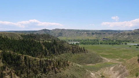 Wide down at muddy river on windy summer day Video stock 83692248