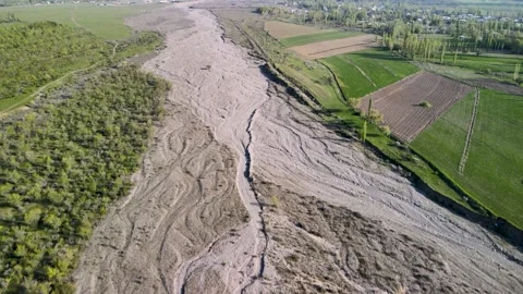 A wide dried-up riverbed Stock Footage 338337618