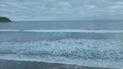 Wide drone advancing toward horizon above waves Stock Footage 340991845