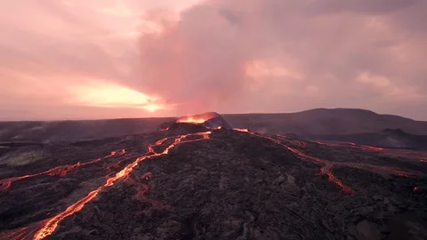 Wide Drone Around Erupting Volcano At Sunset. Magma Flowing Lava Shooting Out Stock Footage 256714970