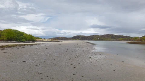 Wide drone flight over the expansive sands of Morar Beach Stock Footage 336170934
