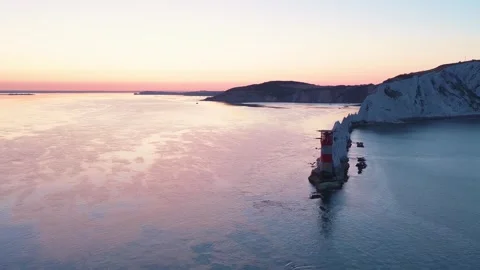 Wide Drone Pan of The Needles Lighthouse at Sunrise Isle of Wight Stock Footage 338065989