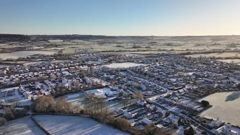 Wide Drone Pan Shot of Snow-Covered Charfield UK Countryside in 4K Видео 329968264