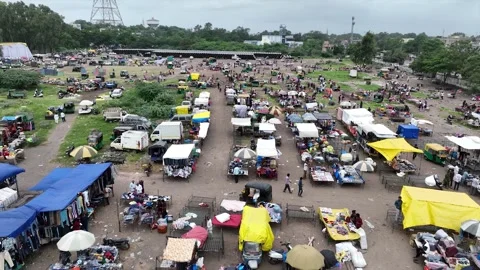 Wide Drone Panorama of Large Flea Market Setup with Colorful Canopies Under Stock Footage 346004045
