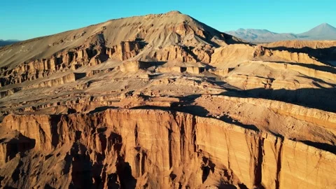 Wide drone perspective highlighting textured mountains and glistening salt Stock Footage 316287328