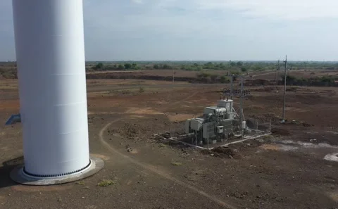 Wide Drone Perspective Showing Wind Turbine Array Above Dry Farmland Stock Footage 342489011