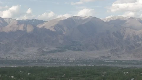 Wide Drone Push In Through Ladakh Forest Revealing Village and Mountain Valley Stock Footage 335759950