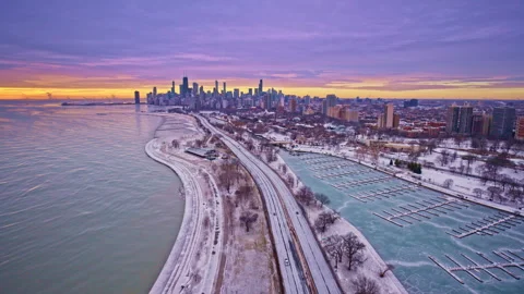 Wide drone shot of Chicago’s Loop at daybreak with skyline and lake visible. Stock Footage 331235899