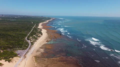 Wide Drone Shot Hovering Over Sea, Coast, Waves, Green Landscape, Coastal Road,  Stock Footage 306312319