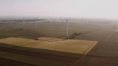 Wide drone shot of wind power plants on the horizon. Stock Footage 149112152