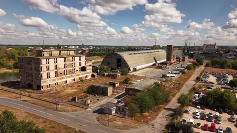 Wide Drone View of Abandoned Oval Factory and Cityscape Serbia 4K 库存影片 346547100