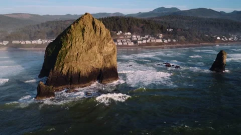 Wide Drone View of Cannon Beach and Haystack Rock at Sunset Stock Footage 332083025