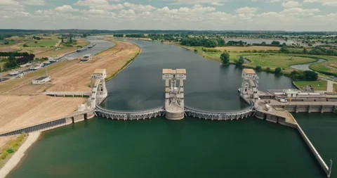 Wide Drone View of Dutch Hydroelectric Power Plant with Canal Water Level Stock Footage 341921925
