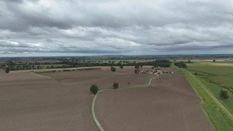 Wide drone view of flat agricultural fields and rural roads in the Po Valley 스톡 동영상 330846986