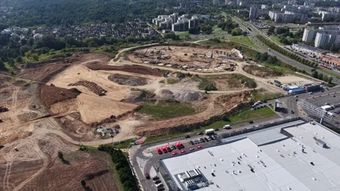 Wide drone view over Vilnius National Stadium construction site with excavation Video stock 327790402