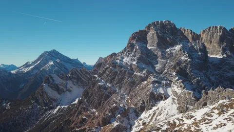 Wide Drone View of Snowy Rocky Peaks in the Cadore Dolomites, Italy Stock Footage 335807232