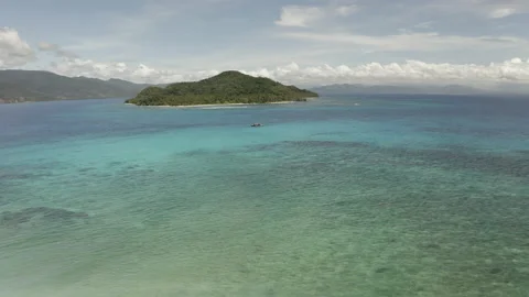 Wide Drone View of Turquoise Reef Waters and Small Island Stock Footage 237972605