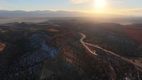 Wide Drone View of Winding Road into Los Alamos with Epic Jemez Mountains in Stock Footage 328715010