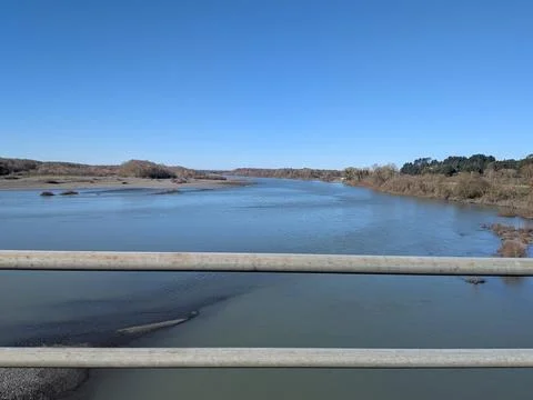 Wide Eel River landscape with riverside vegetation and iron beam Stock Photos