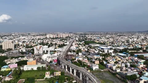 A wide, elevated (drone) shot of a dense, developing residential area in 스톡 동영상 318279953
