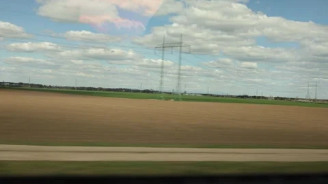 Wide empty fields stretch under a sky full of clouds waiting for the season to b Stock Footage 306596985