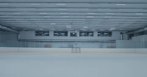 WIDE EST Lights are turning on on an empty ice hockey training rink, no players Stock Footage 94560995