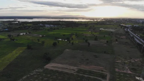 Wide fields with sunset behind Stock Footage 106506745