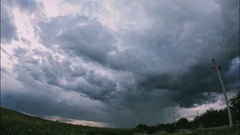 Wide filmed clouds rapidly flow in the gloomy sky, timelapse before the storm Stock Footage 234049762