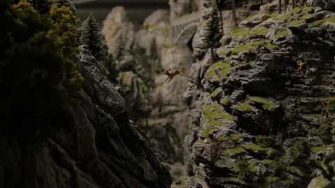 Wide Focus pull of a Miniature Jumping Deer Stock Footage 92773383